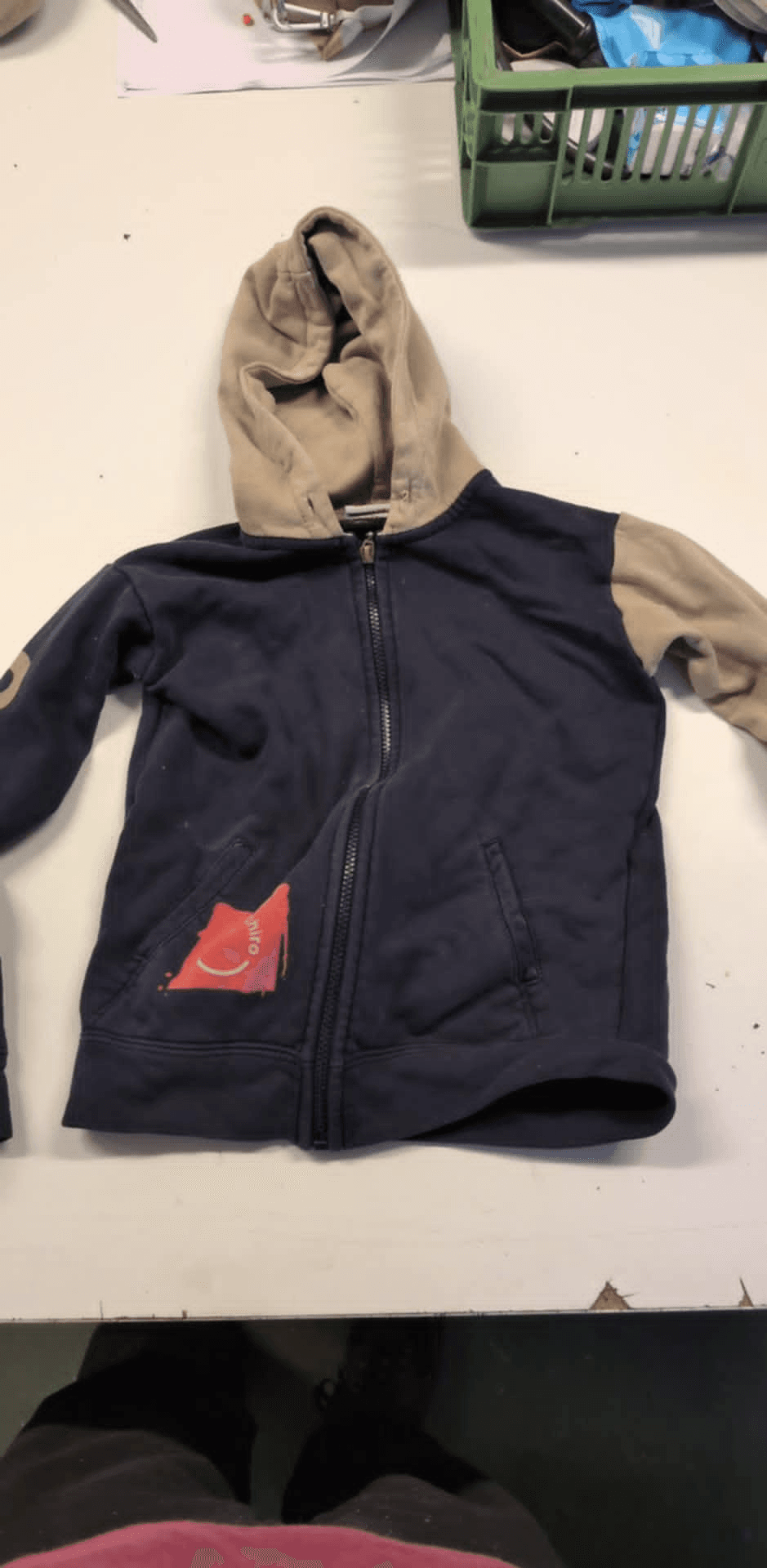 a blue and tan hoodie with a patch that says ' i love you ' on it